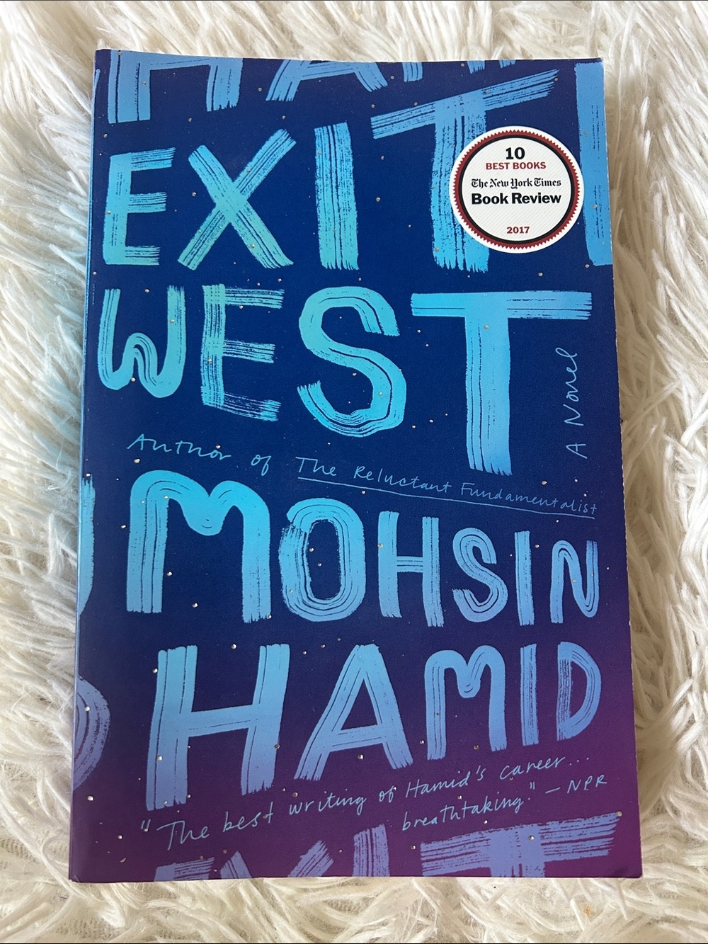 'Exit West' Paperback Book by Mohsin Hamid - Blue